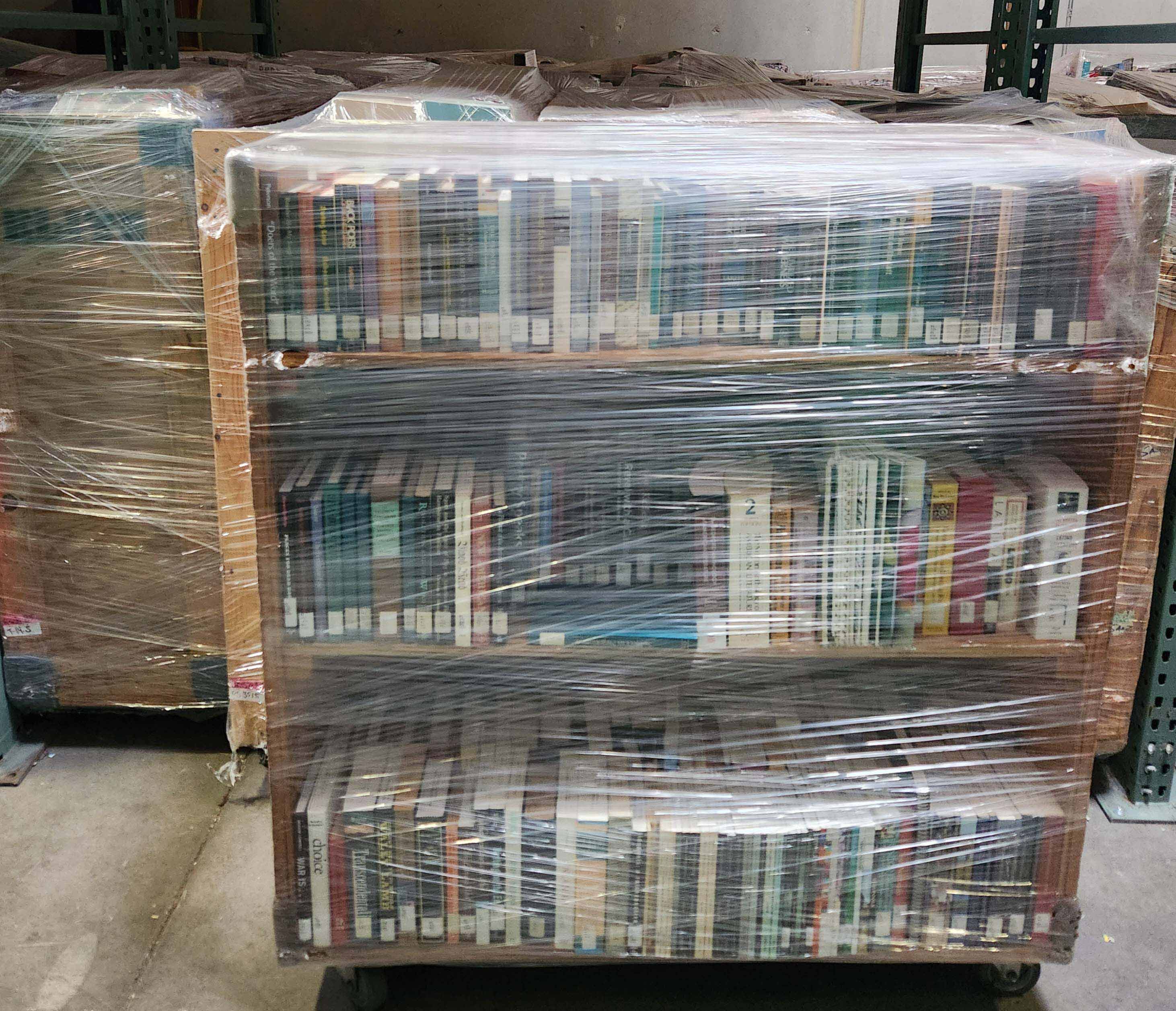 Books wrapped in cellophane being protected for safe moving.